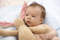 Adorable baby with plush bunny