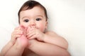 Adorable baby sucking his toes Royalty Free Stock Photo