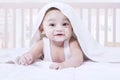 Adorable baby try to crawl on bed Royalty Free Stock Photo