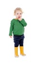 Adorable baby with yellow gumboots