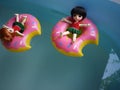 Adorable BJD Ball Joint Doll branded LATI in swimming suit. They`re ready to play water with colorful pool floats.