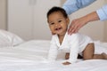 Adorable Black Baby Getting Massage From Loving Mom While Relaxing On Bed Royalty Free Stock Photo