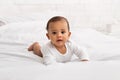 Adorable Black Baby Toddler Crawling On Bed In Bedroom Indoor Royalty Free Stock Photo