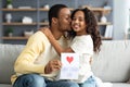 Adorable black daughter greeting her dad with Fathers Day Royalty Free Stock Photo