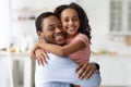 Adorable black family father and daughter hugging, copy space Royalty Free Stock Photo