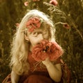 Adorable blond girl with red poppies