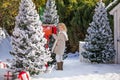 Adorable blonde girl sending her letter to Santa, Christmas time Royalty Free Stock Photo