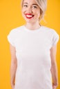 Adorable blonde happy woman in white t-shirt with no print.