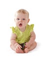 Adorable blue eyed baby sits and vocalizes. Royalty Free Stock Photo