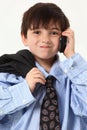 Adorable Boy in Baggy Suit with Cellphone Royalty Free Stock Photo