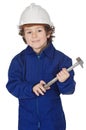 Adorable boy dressed worker in a hammer and a helmet Royalty Free Stock Photo