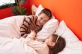 Adorable boy and girl smiling confident lying on bed at bedroom Royalty Free Stock Photo