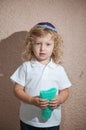 Adorable boy holds case for holiday citrus