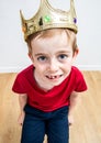 Adorable boy with missing tooth and crown, high angle portrait Royalty Free Stock Photo