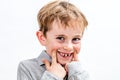 Adorable boy playing with a fake toothless smile, isolated portrait Royalty Free Stock Photo