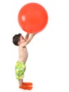 Adorable Boy Ready To In Swim Gear With Giant Orange Ball Over W Royalty Free Stock Photo