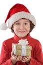 Adorable boy with red hat of Christmas and one gif Royalty Free Stock Photo