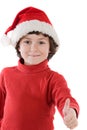 Adorable boy with red hat of Christmas saying O.K. Royalty Free Stock Photo