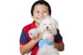 Adorable boy smiling and carrying his cute dog Royalty Free Stock Photo