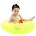 Adorable Boy In Swimsuit Sitting In Green Inner Tube Over White Royalty Free Stock Photo