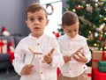 Adorable boys celebrating christmas at home