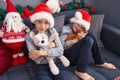 Adorable boys hugging teddy bear celebrating christmas at home
