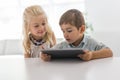 Adorable brother and sister young child using tablet Royalty Free Stock Photo