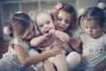 Adorable brothers and sisters poses to camera. Baby boy. Royalty Free Stock Photo