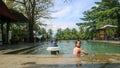 brothers and sisters swimming in the pool Royalty Free Stock Photo