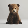 Adorable Brown Bear Cub Sitting on Grey Background Royalty Free Stock Photo
