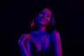 Adorable busty woman beaming smiling hang out at disco hall with friends dancing under ultraviolet lights background Royalty Free Stock Photo