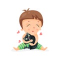 Adorable cartoon toddler baby hugging a black kitten colorful character vector Illustration