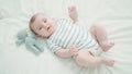 Adorable caucasian baby smiling confident lying on bed with at bedroom Royalty Free Stock Photo
