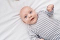 Adorable caucasian baby smiling confident lying on bed at bedroom Royalty Free Stock Photo