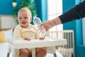 Adorable caucasian baby smiling confident sitting on highchair at bedroom Royalty Free Stock Photo