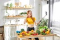 adorable caucasian female with red hair drinking juice smoothie detox and talking at smartphone camera, taking photo