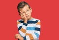 Adorable caucasian kid wearing casual clothes thinking looking tired and bored with depression problems with crossed arms Royalty Free Stock Photo