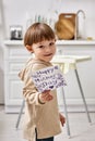 adorable cheerful toddler boy posing with Royalty Free Stock Photo