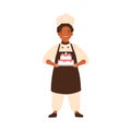 Adorable chief cook child, cute kid in chef uniform. Confectioner boy in cooking apron, toques, with sweet cake pastry