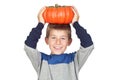 Adorable child with a big pumpkin Royalty Free Stock Photo
