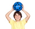 Adorable child with a blue soccer ball Royalty Free Stock Photo