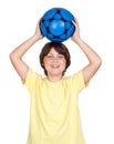 Adorable child with a blue soccer ball Royalty Free Stock Photo