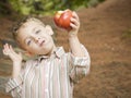 Adorable Child Boy Eating Red Apple Outside