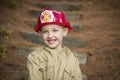 Adorable Child Boy with Fireman Hat Playing Outside Royalty Free Stock Photo