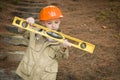 Adorable Child Boy with Level Playing Handyman Outside