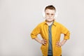 adorable child boy in white headphones and glasses isolated on grey background Royalty Free Stock Photo