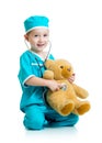 Adorable child with clothes of doctor examining Royalty Free Stock Photo