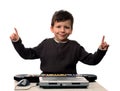 Adorable child with electric piano and laptop Royalty Free Stock Photo