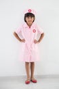 Child girl uniformed as doctor or nurse