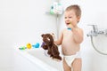 Adorable child learing how to brush his teeth